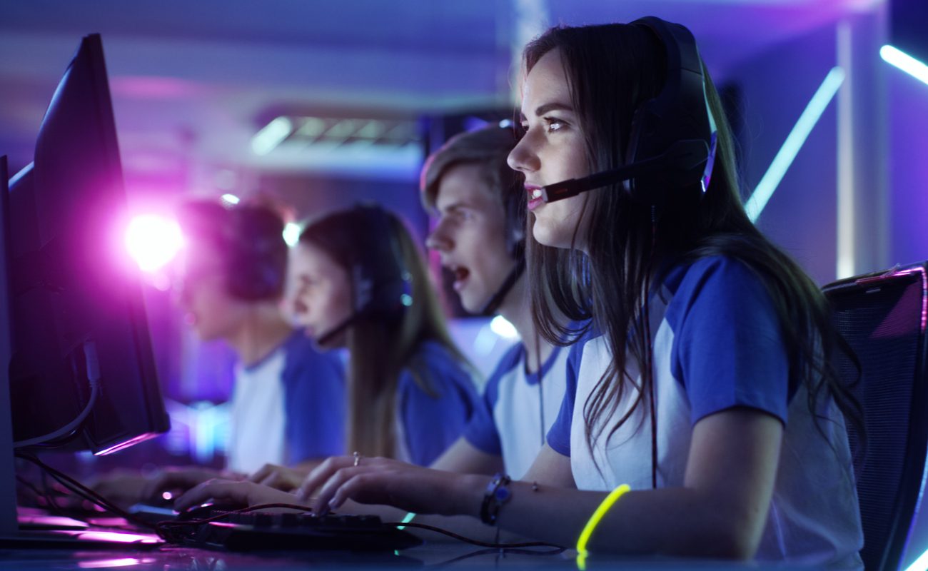 Professional gamer girl and her team participate in eSport cyber games tournament