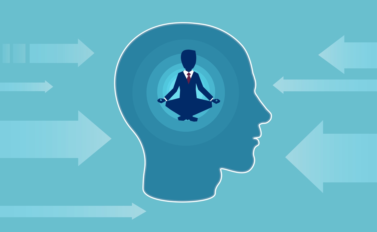 Graphic of a man in a suit meditating inside a head