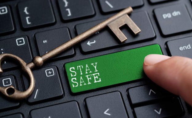 Shift key replaced with a stay safe key on a keyboard with a metal key on it