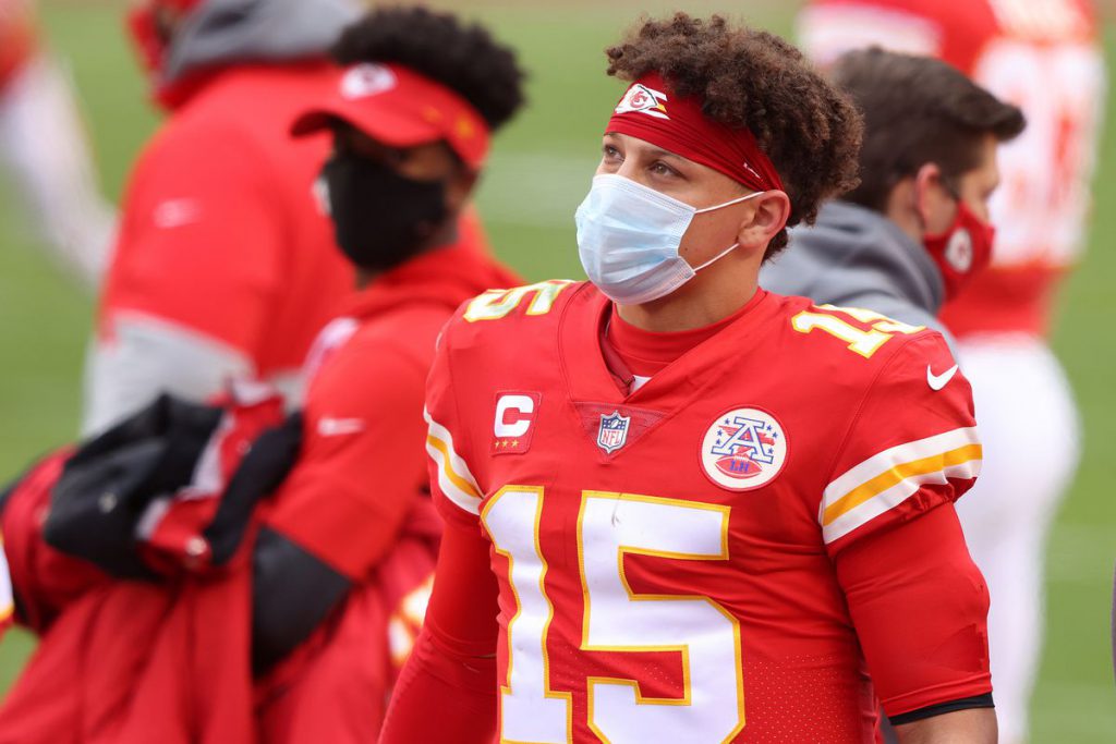 Kansas City Chiefs Quarterback Patrick Mahomes watches on while obeying COVID-19 protocol